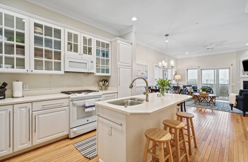 Waters Edge House | 110 Waters Edge! Luxury River Views with Community Pool, Screen Porch