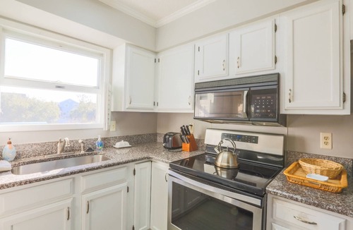 Pelican Bay House | Beach Home with Lagoon Views, Screened Porch, Deck & Community Pool. Only 5 Minute Walk to Beach!