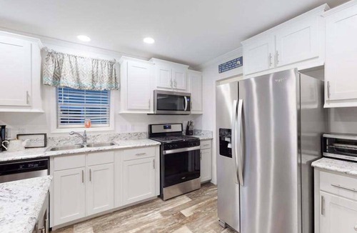 Montego Bay House | Beachy bayside home in quiet neighborhood with patio, central AC, pool, & tennis