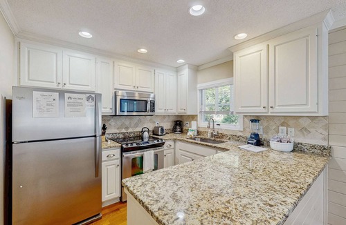 Pelican Bay House | Beautifully decorated cottage steps from the beach with pool & open layout