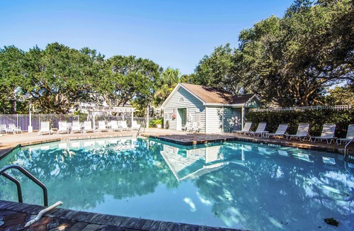 Pelican Bay House | Beautifully decorated cottage steps from the beach with pool & open layout