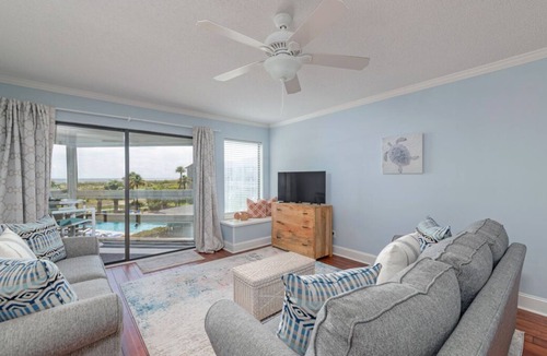 Oceanmarsh Subdivision Condo | Charming condo with a screened-in porch, water views, and access to complex pool
