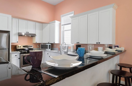 Saint Roch House | Cute and Cozy 2BR/2BA w/Parking, Yard, King Suite & Blocks to Local Favorites