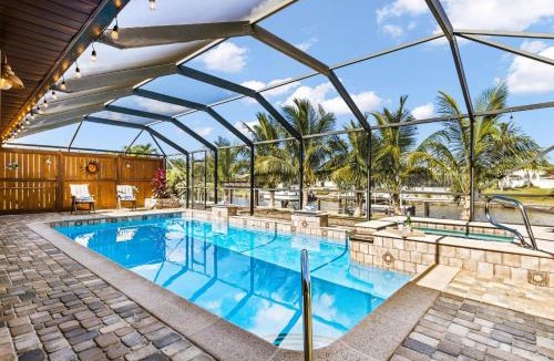 Fort Myers Villa | Direct Access Waterfront Villa with Heated Pool & Spa - Edgewater Escape - Roelens Vacations