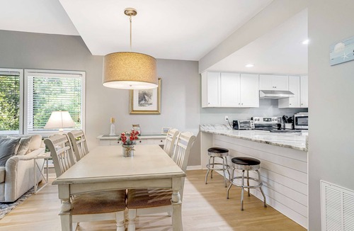 Ocean Ridge Condo | Dog-friendly beach home with screened porch, charming interior, & W/D
