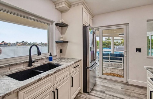 Eight Lakes Villa | Dolphin Cove Villa Gulf Access Waterfront Heated Pool & Hot Tub Game Room