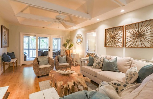 West Beach Condo | Enjoy Stunning River Views, Community Pool & Beautiful Furnishings, Dog Friendly. Walk to Beach!