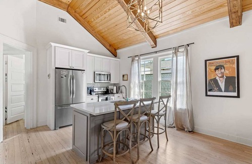 Uptown Historic District Apartment | Historic 3BR on Magazine St with front & rear balconies. Walk to cafés, quick ride to FQ & Dome.