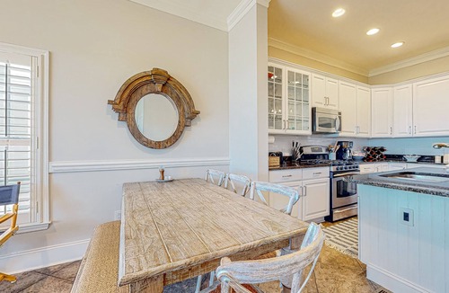 Waters Edge House | Inviting waterfront townhouse with beach access, balcony, W/D, pool & dock