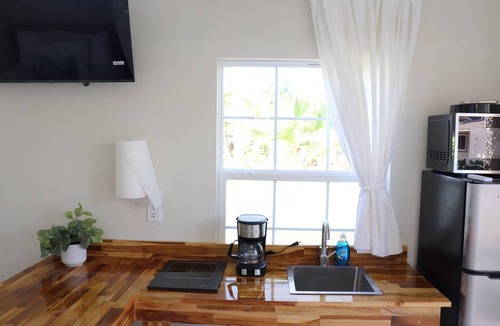 Westchase House | Luxury 1-bedroom cottage with pool in prime location. Peaceful resort style.