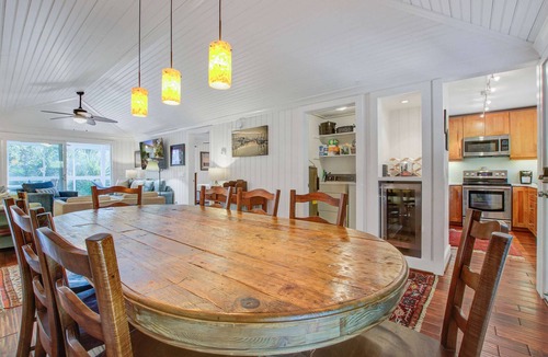 Twin Oaks House | Palm-surrounded abode with screened-in balcony, chef's kitchen, smart TVs, & W/D