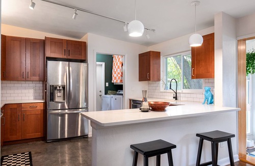 Audubon Park House | Vibrant Orlando Lakefront Cat Lover's Retreat with Pool & Gardens