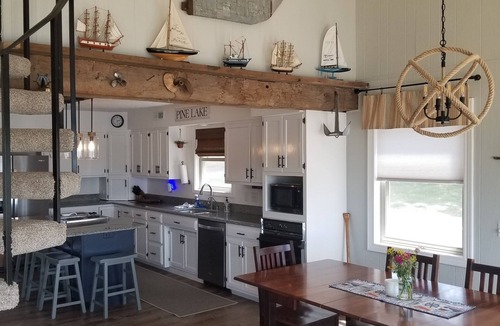 Plainwell House | Waterfront, Private Dock, Pizza Oven + Outdoor Fireplace + Sunset Views