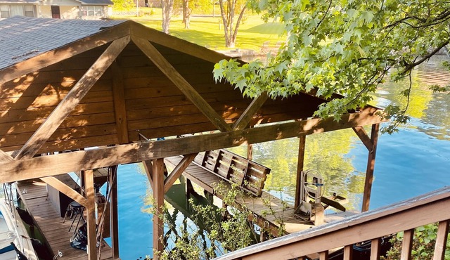 Lakehouse with 3 Decks, 2 Covered Boat Slips & Swim Dock!