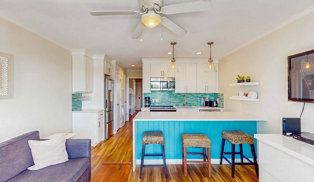 Oceanfront condo with water views, pool, balcony, & easy beach access