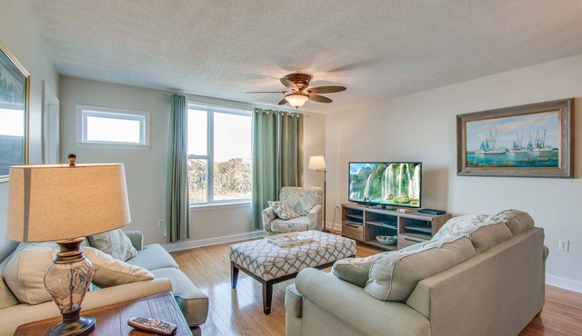Second-floor condo with river views and access to a community pool