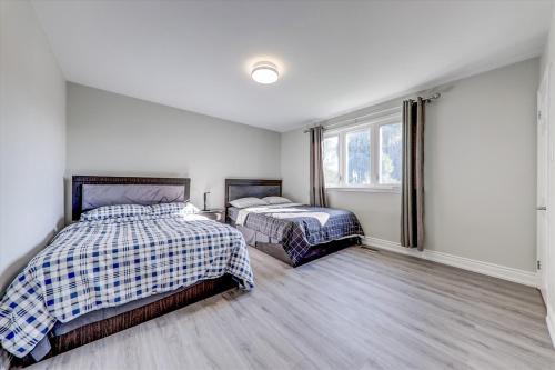 Stunning 7 Br RougeView Home with 2 Kitchens, 5 Bathrooms, Amazing Backyard & 8-Car Parking in Toronto