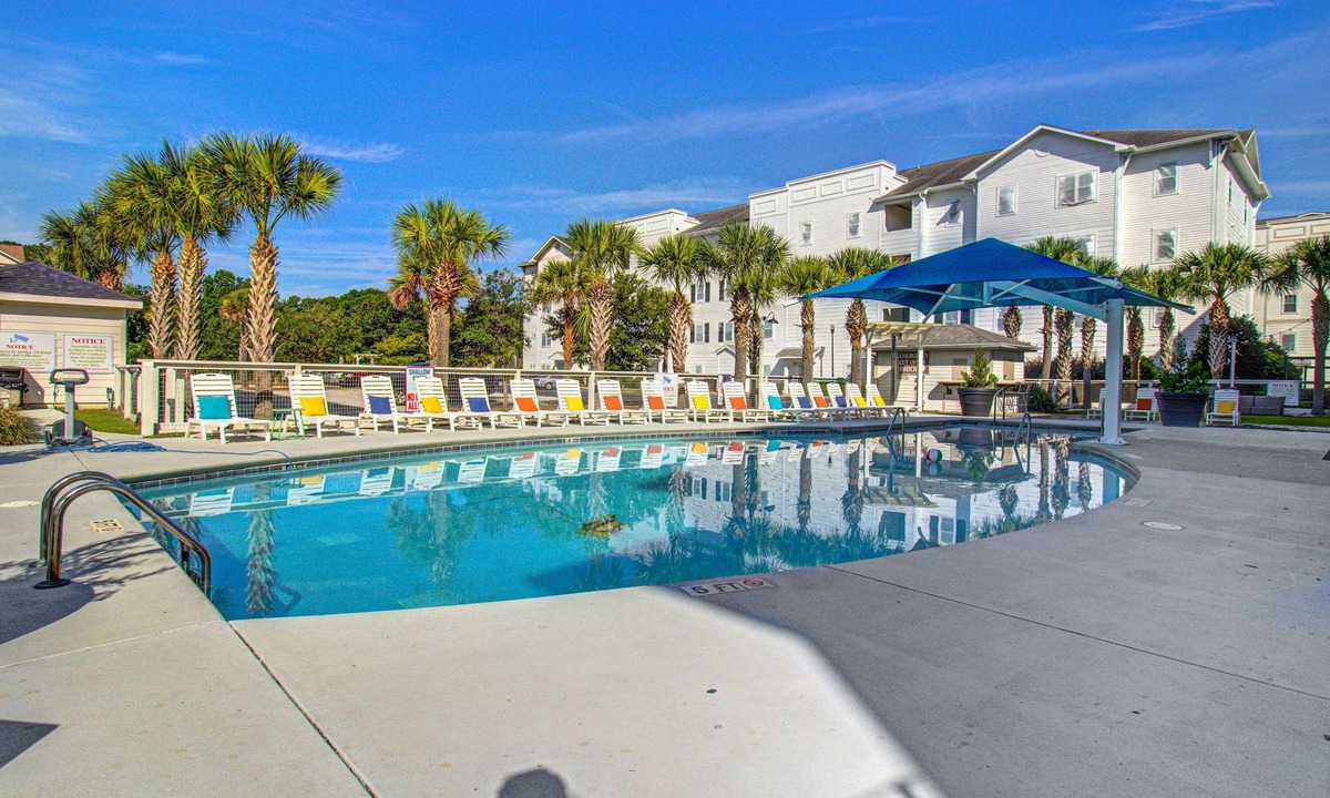 Goose Creek Condo | Stylish 2BR: Pet Friendly in Walkable Resort with a Pool