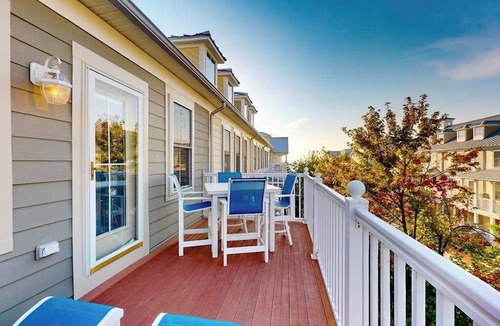 Sunset Island House | 4-story townhome with resort pools, beaches, water access, & great location