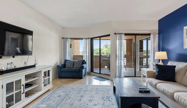 Waterfront condo with walkable locale, central AC, washer dryer, & shared pool